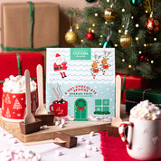 Christmas House sharing pack of hot chocolate spoons.