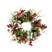 A festive artificial Christmas wreath featuring vibrant red berries, glossy green leaves, and soft silver eucalyptus foliage, isolated on a solid white background.